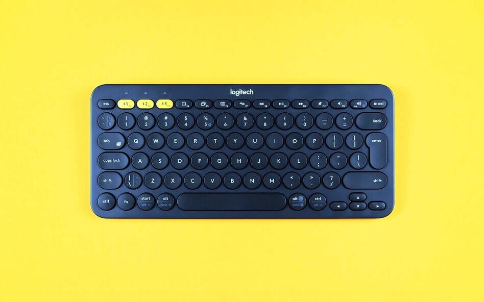black keyboard on yellow background