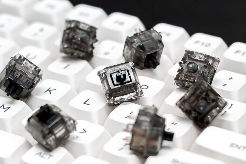 mechanical keyboard with white keys and black swithes