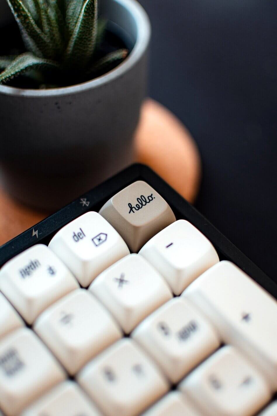 modular keyboard with white pesonalised keys on the desk